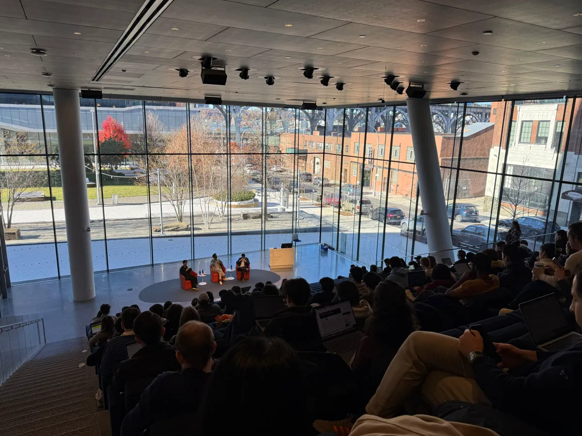 A panel discussion in a bright room.